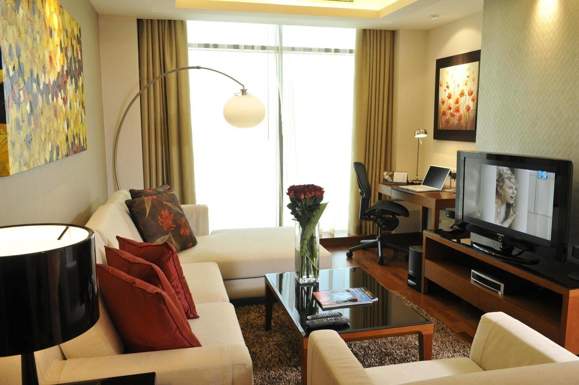Fraser Suites Seef Bahrain Manama Quarto foto A living room in a serviced apartment in Kuala Lumpur, Malaysia